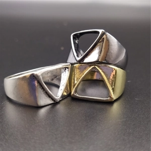 Three minimalist triangular open rings in silver, gold, and gunmetal black finishes