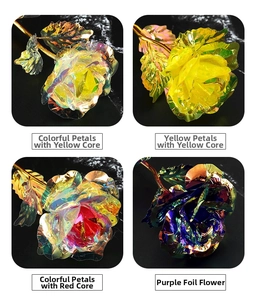 Detail view of four artificial 24k gold foil roses in iridescent rainbow colors on black marble