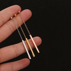 Minimalist geometric bar earrings set in silver gold and rose gold on model hand