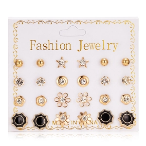 Close-up of 12 pairs of gold alloy and zircon stud earrings on a display card