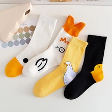 Detail view of cotton mid-calf socks with cute cartoon duck and chick embroidery patterns