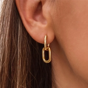 Elegant gold U-shape chain link earrings shown on a model in a side profile view