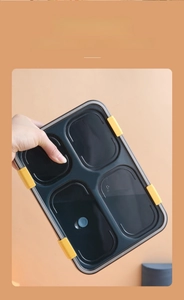 Detail of four-compartment lunch box with secure leak-proof seal and vent valve