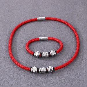 Close-up of red braided leather cord bracelet set with silver stainless steel beads
