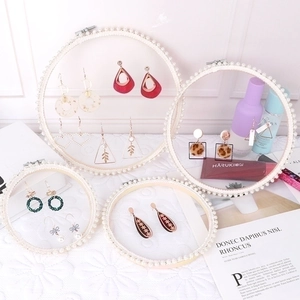 Set of lace earring display stands with pearl circular frames in various sizes