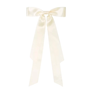 Detailed view of beige satin oversized bow hair clip with elegant silk texture