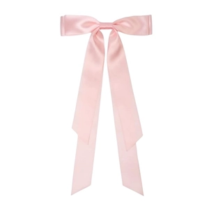 Detail of pink satin bow hair clip with long ribbons on a white background