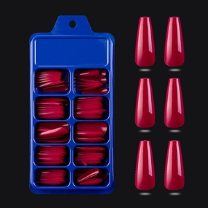 Deep pink coffin press-on nails set with a blue storage box on a black background