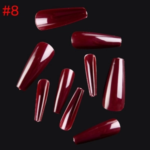 Detailed close-up of glossy deep wine red coffin shaped press on nails with mirrored finish