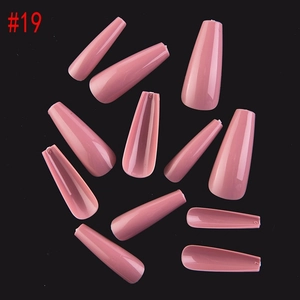 Detailed view of glossy dusty rose coffin press-on nails with size markings on inner tips