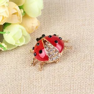 Exquisite red ladybug brooch with sparkling rhinestones and golden metal insect legs
