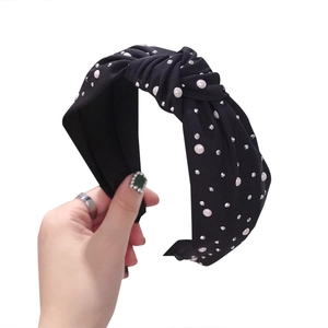 Elegant black twist headband for women with white pearls and sparkling rhinestones
