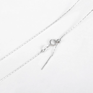 Detailed macro view of S925 sterling silver chain with ITALY hallmark and adjustable bead