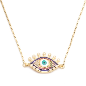 Collana malocchio dorata con iride in zircone blu e dettagli di ciglia scintillanti