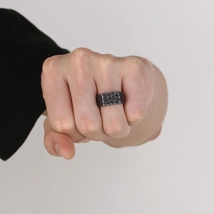 Men's retro stainless steel ring with hammered texture and vintage finish on hand