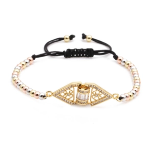 Detail of adjustable woven bracelet with gold-tone cubic zirconia geometric triangle charms