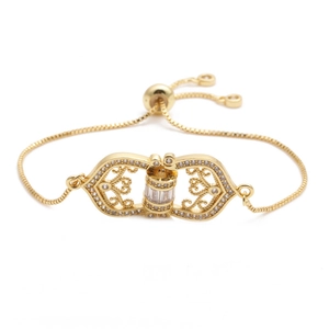 Macro detail of gold-plated bracelet with openwork pattern and micro-set cubic zirconia