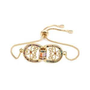 Detailed close-up of gold adjustable bracelet featuring colorful micro-pave zircon stones