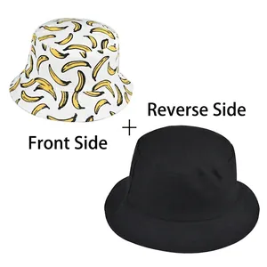 Reversible bucket hat with yellow banana pattern on white and solid black inner side