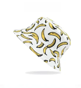 Close-up of white cotton bucket hat featuring vibrant banana fruit print patterns