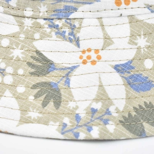 Detailed close-up of floral print and cross-weave cotton texture on the sun bucket hat