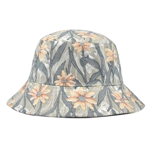 Detailed pattern of orange sunflowers and grey leaves on a green tie-dye bucket hat