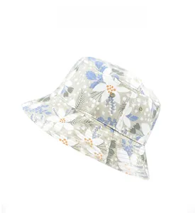 Detail of floral bucket hat showing tropical blue and white flower print on cotton fabric