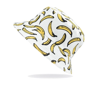 White canvas bucket hat with yellow banana print for summer outdoor sun protection