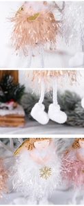 Detail of plush Christmas angel ornament with pink skirt and golden snowflake sequin