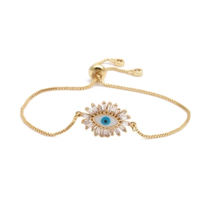 Adjustable golden box chain bracelet featuring a zircon evil eye pendant on white background