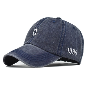 Navy blue washed cotton baseball cap with white C embroidery and 1999 side detail
