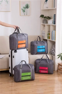 Waterproof travel storage bags with luggage handle strap and front zipper pockets