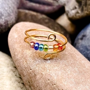 Handcrafted S925 silver fidget ring with colorful rainbow beads on natural stone