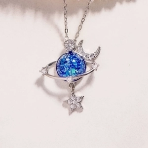 S925 silver celestial necklace featuring a blue planet pendant with moon and star charms