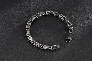 Close-up of industrial box link chain bracelet with vintage oxidized finish and lobster clasp