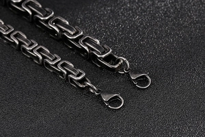 Macro shot of vintage silver Byzantine chain bracelet with secure lobster clasp detail