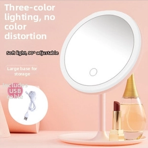 Detail of pink LED makeup mirror with 3-color lighting and storage tray base