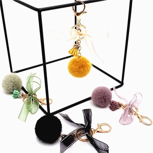 Cute faux fur pompom keychain with lace bow and leather tassel in five vibrant colors