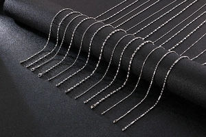 Detailed array of various stainless steel chain styles including ball and snake links