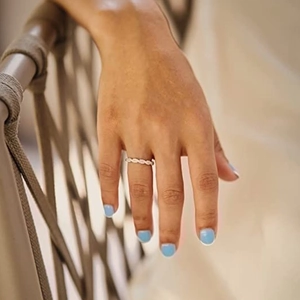 Elegant thin gold twist rope ring with minimalist design for stacking on woman's finger