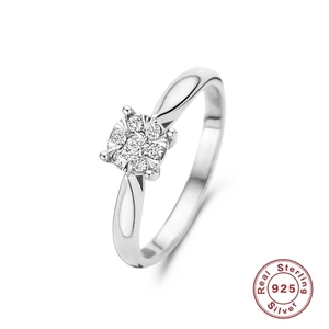 Macro detail of 925 sterling silver ring featuring a seven-stone diamond flower cluster design