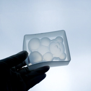 Detailed view of translucent bear-shaped silicone mold for DIY resin crafts and ornaments
