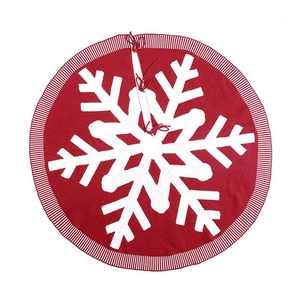Knitted burgundy Christmas tree skirt with large white snowflake and striped edges