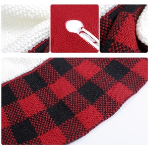 Detail of red and black buffalo plaid knitted Christmas tree skirt with secure tie closure