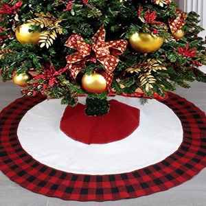 Detail view of the red and white knitted Christmas tree skirt with buffalo plaid edges