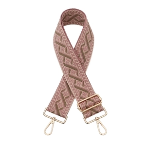 Detail of adjustable bag strap with vintage gray-pink and brown wave patterns