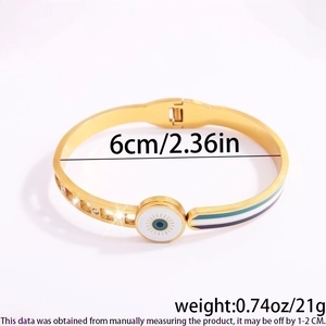 Detail showing 6cm diameter and 21g weight of gold plated evil eye cuff bracelet