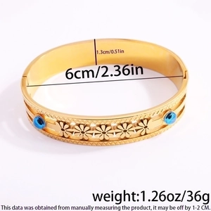 Detail showing dimensions and weight of the gold evil eye steel bangle with flower motifs