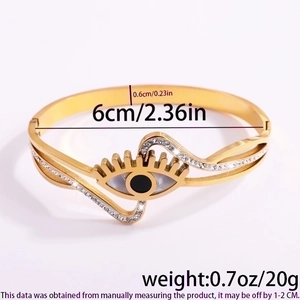Detail showing dimensions of golden stainless steel evil eye cuff with crystal inlay