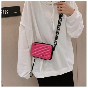 Mini rose pink suitcase crossbody bag with Forever Young strap and hardshell design